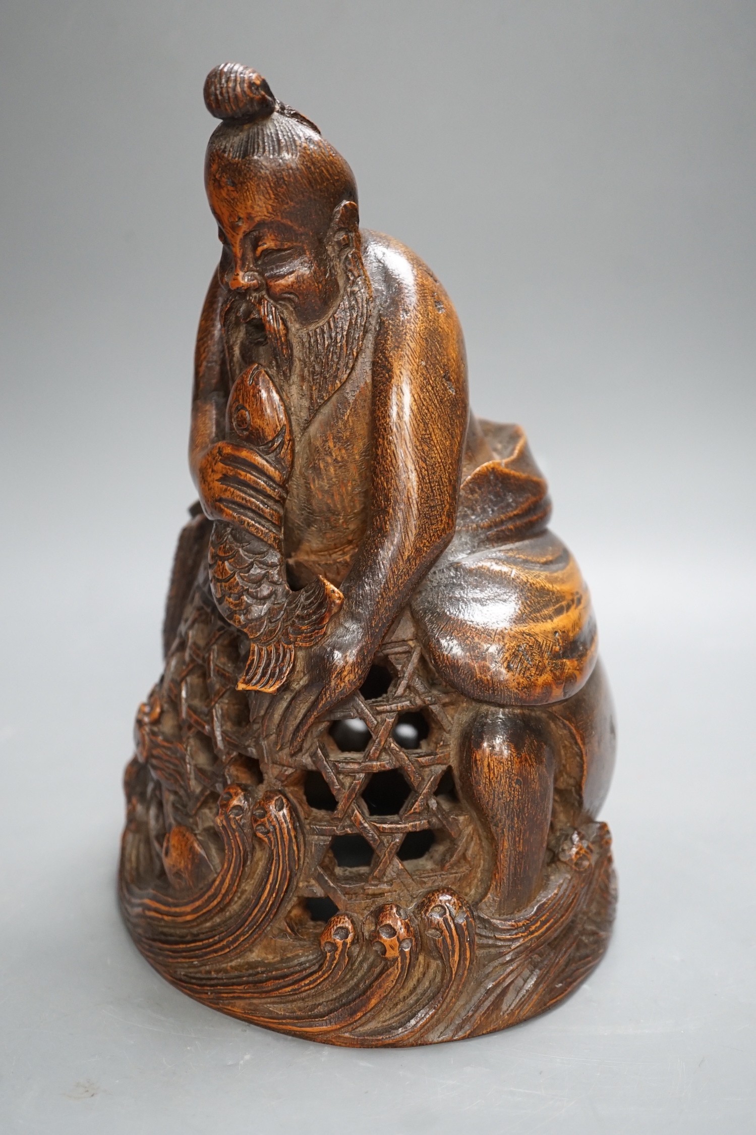 A Chinese bamboo figure of a fisherman, 19th century, 23cms high